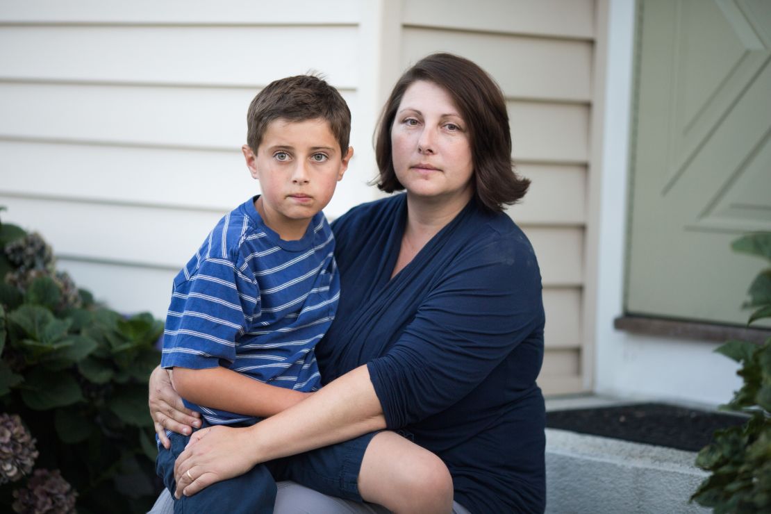 Danielle holds Trevor on the family stoop. The family agreed to speak with CNN 10 years after her testimony because the pain is still raw: "I wish to God we knew nothing about catastrophic epilepsy and Acthar."  