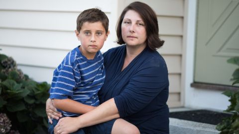Danielle holds Trevor on the family stoop. The family agreed to speak with CNN 10 years after her testimony because the pain is still raw: "I wish to God we knew nothing about catastrophic epilepsy and Acthar."  