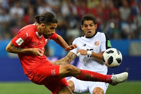 Costa Rican defender Cristian Gamboa, right, closes in on Switzerland's Ricardo Rodriguez.