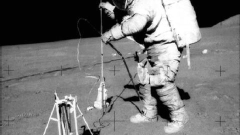 Apollo 15 astronaut David Scott uses the Apollo Lunar Surface Drill to drill hollow tubes into the lunar surface for the probes.
