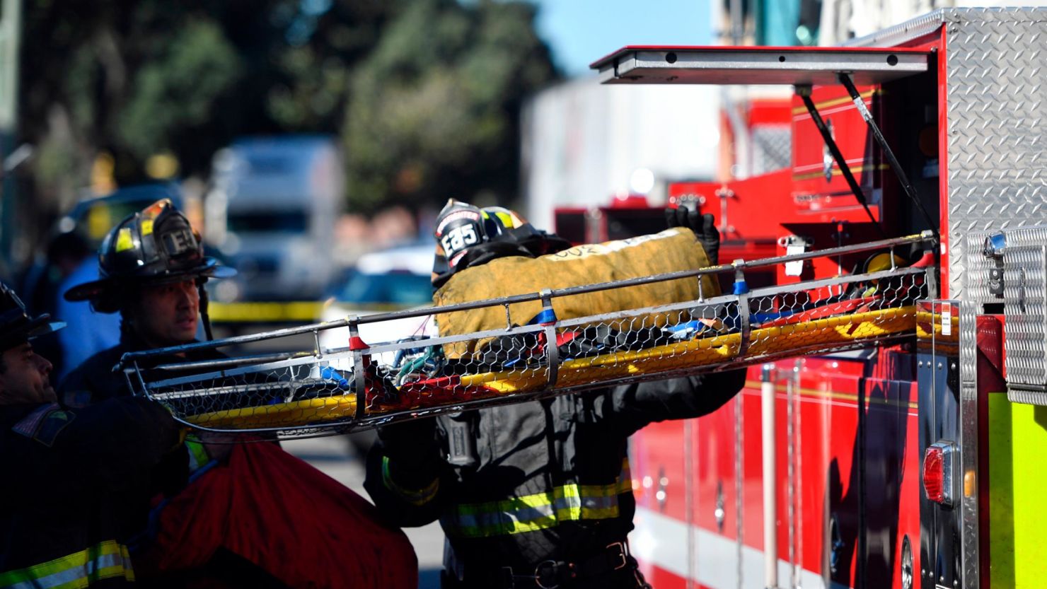 A stretcher is taken out of a fire truck at the scene of a fire that destroyed a warehouse on December. 3, 2016, in Oakland, Calif. A deadly fire broke out during a rave at the converted warehouse in the San Francisco Bay Area.