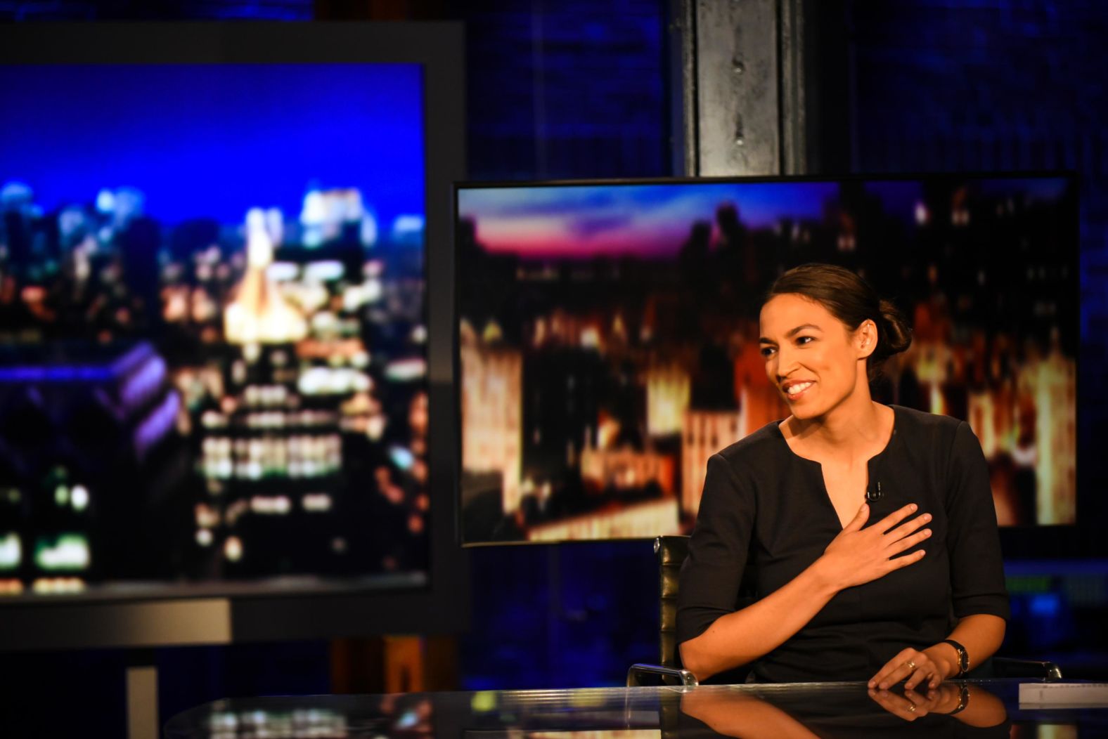 Ocasio-Cortez reacts to video during her interview with CNN's Erin Burnett on Wednesday. During the 2016 presidential season, Ocasio-Cortez worked as an organizer for US Sen. Bernie Sanders.