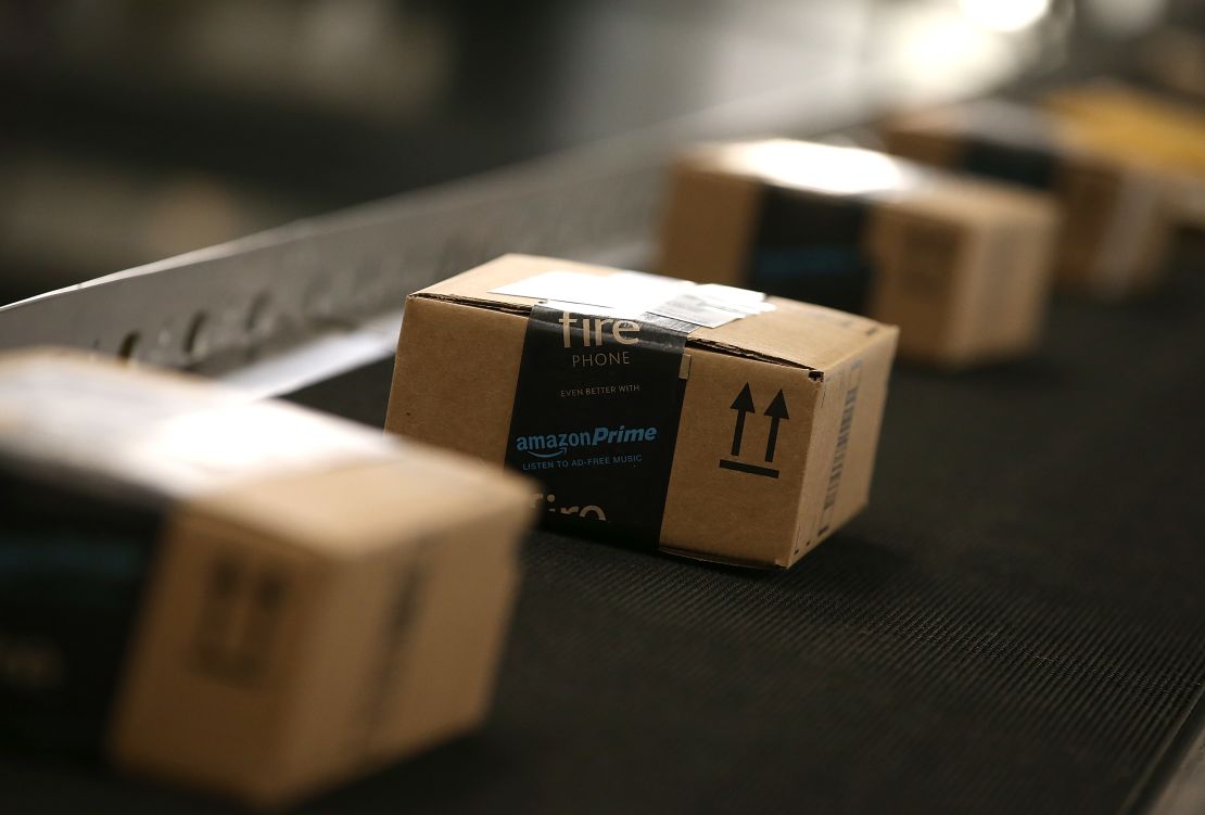 Boxes move along a conveyor belt at an Amazon fulfillment center.