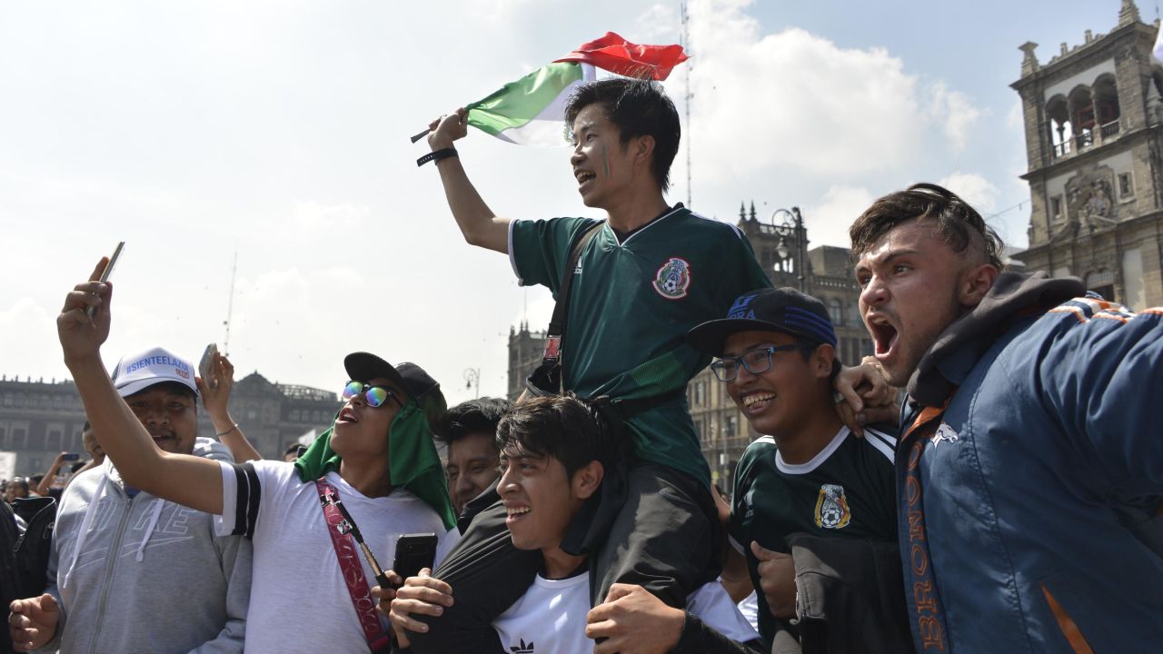Mexico fans celebrate at the end of the World Cup group F match between Germany and South Korea, at a public event at the Zocalo Square in Mexico City, on June 27, 2018. (Photo by JOHAN ORDONEZ / AFP)        (Photo credit should read JOHAN ORDONEZ/AFP/Getty Images)