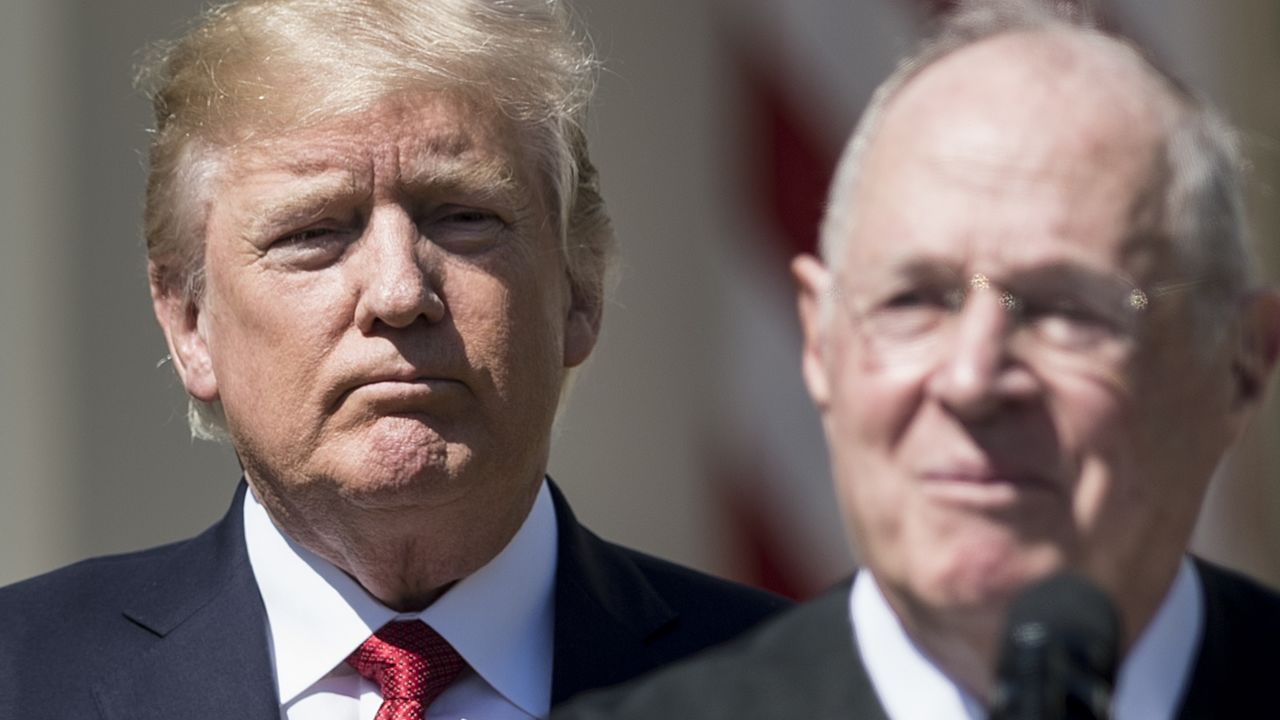 US President Donald Trump (L) listens while Supreme Court Justice Anthony Kennedy speaks during a ceremony in the Rose Garden of the White House April 10, 2017 in Washington, DC. / AFP PHOTO / Brendan Smialowski        (Photo credit should read BRENDAN SMIALOWSKI/AFP/Getty Images)