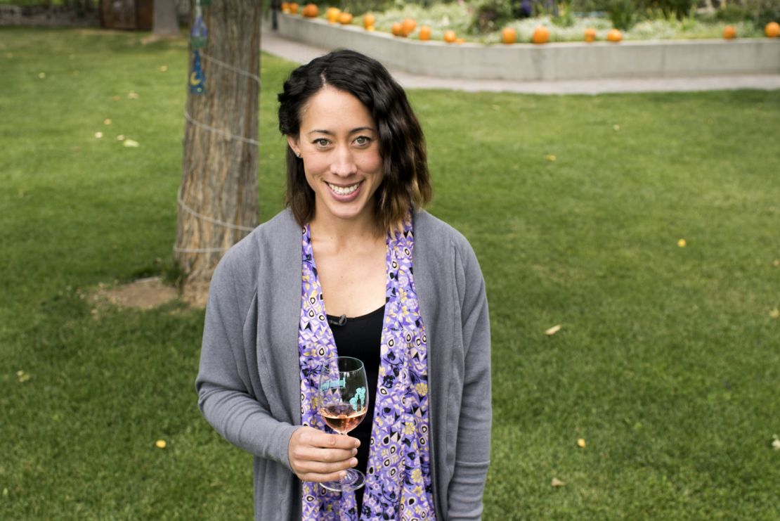 Tammy Stowe McClure poses with a glass of Indian Creek wine.