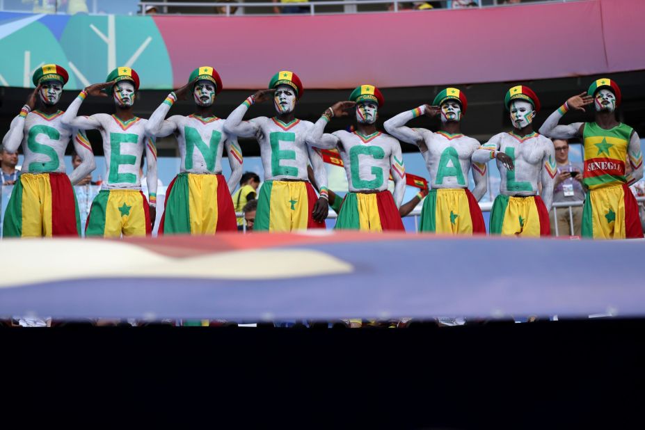 Senegal fans salute before the match against Colombia.