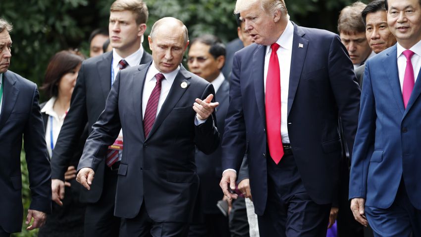 US President Donald Trump (R) and Russia's President Vladimir Putin chat as they walk together to take part in the "family photo" during the Asia-Pacific Economic Cooperation (APEC) leaders' summit in the central Vietnamese city of Danang on November 11, 2017.
World leaders and senior business figures are gathering in the Vietnamese city of Danang this week for the annual 21-member APEC summit. / AFP PHOTO / POOL / JORGE SILVA (Photo credit should read JORGE SILVA/AFP/Getty Images)