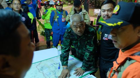 Thai officials look over a map of Tham Luang Nang Non cave on June 28, 2018, as they search for the missing boys. 