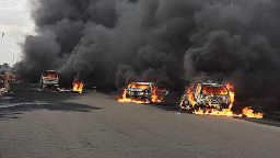 Cars burn at the scene of the deadly explosion in Lagos, Nigeria. 