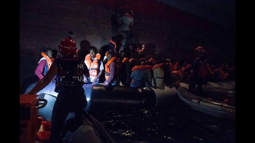 TOPSHOT - This handout picture taken on June 22, 2018 off the coast of Libya and received from the German NGO "Mission Lifeline" shows migrants boarding a container ship of Danish shipping company Maersk Line after they were rescued from a shipwrecked vessel at sea.
Five migrants died and nearly 200 were rescued off the coast of Libya while trying to cross the Mediterranean to Europe in two boats, the Libyan navy said on June 23, 2018. Italy said that it would seize two rescue migrant ships, adding that they were "illegally" flying the Dutch flag. The ships Lifeline and Seefuchs, of the German NGO Mission Lifeline and Sea Eye, "will be seized by the Italian government and directed into our ports" to launch an investigation into their legal status, announced Italy's infrastructure minister Danilo Toninelli. / AFP PHOTO / Mission Lifeline e. V. / Danilo CAMPAILLA / RESTRICTED TO EDITORIAL USE - MANDATORY CREDIT "AFP PHOTO / Mission Lifeline e. V. / Danilo Campailla- NO MARKETING NO ADVERTISING CAMPAIGNS - DISTRIBUTED AS A SERVICE TO CLIENTS

DANILO CAMPAILLA/AFP/Getty Image