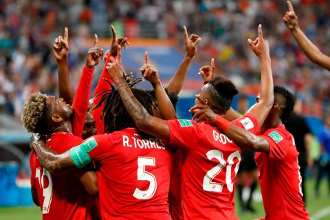 Panama players celebrate after an own goal gave them an early lead against Tunisia.