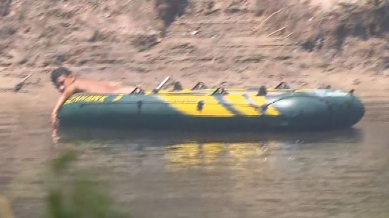 Migrant crossing Rio Grande