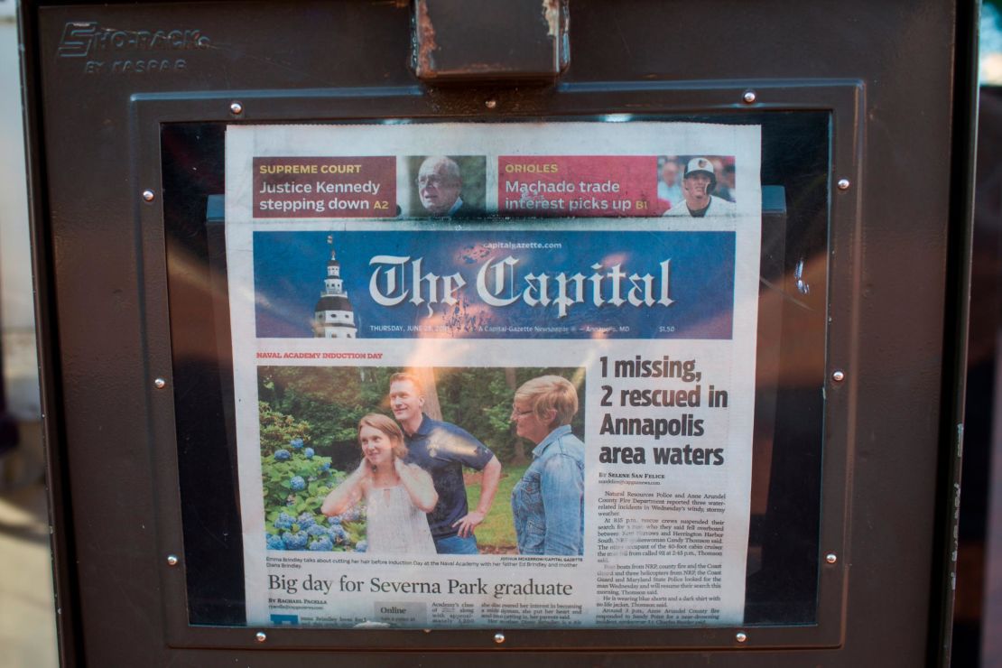 A newspaper stand selling the Capital Gazette. 