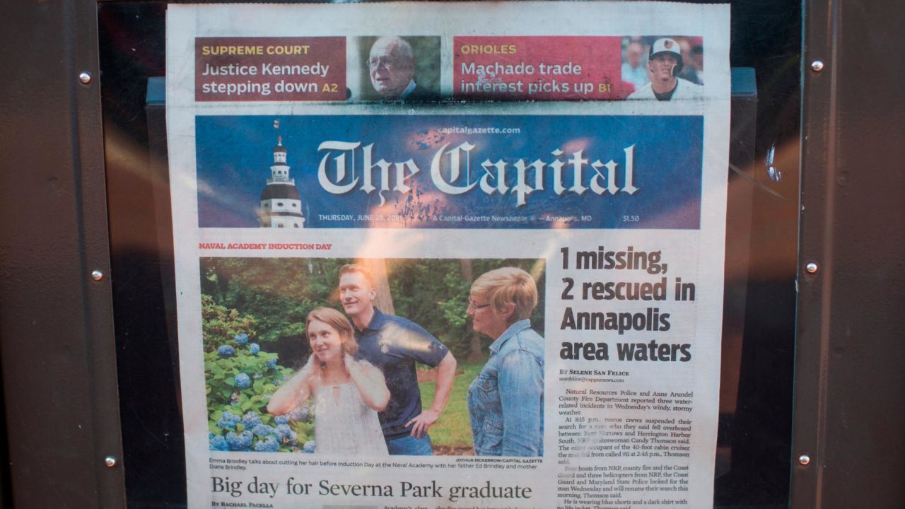 A newspaper stand selling the Capital Gazette.