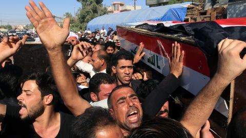 Iraqis carry the coffin of a victim who was kidnapped and then executed by Islamic state group in Karbala city, southern Iraq on Thursday. 