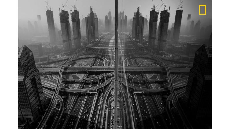 <strong>3rd prize Cities category -- "Reflection"</strong>: The third prize winner in the Cities category of the <a href="http://travel.nationalgeographic.com/photographer-of-the-year-2018/gallery/winners-all/1/" target="_blank" target="_blank">2018 National Geographic Travel Photographer of the Year Contest</a> is <a href="http://yourshot.nationalgeographic.com/profile/606011/" target="_blank" target="_blank">Gaanesh Prasad</a>. Prasad says took the photograph from a glazed window. "I was overwhelmed and excited to see how beautiful the city looks, and my excitement was quadrupled as soon as I saw the reflection of the road and building on the building that I was in," says the winner.