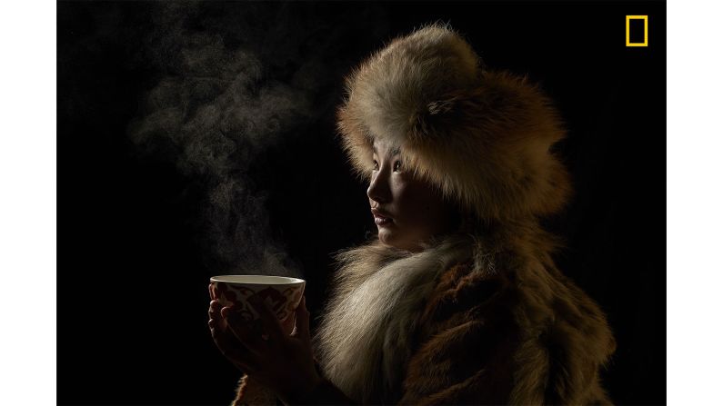 <strong>1st prize People category -- "Tea Culture":</strong> The first prize winner in the People category of the <a href="http://travel.nationalgeographic.com/photographer-of-the-year-2018/gallery/winners-all/1/" target="_blank" target="_blank">2018 National Geographic Travel Photographer of the Year Contest</a> is <a href="http://yourshot.nationalgeographic.com/profile/1156489/" target="_blank" target="_blank">Alessandra Meniconzi</a>, who photographed a Mongolian Golden Eagle hunter drinking tea. "Tea for Kazakh culture is one of the attributes of hospitality," says Meniconzi. "Tea isn't just a drink, but a mix of tradition, culture, relaxation, ceremony, and pleasure."