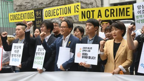 South Korean activists and conscientious objectors to military service seen outside the Constitutional Court in Seoul on June 28, 2018.