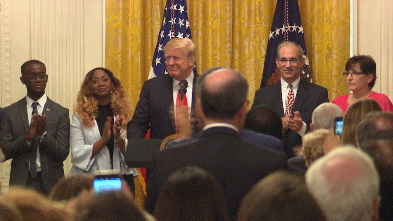 President Donald Trump speaks at a celebration ceremony recognizing the six-month anniversary of his tax cuts and jobs act.