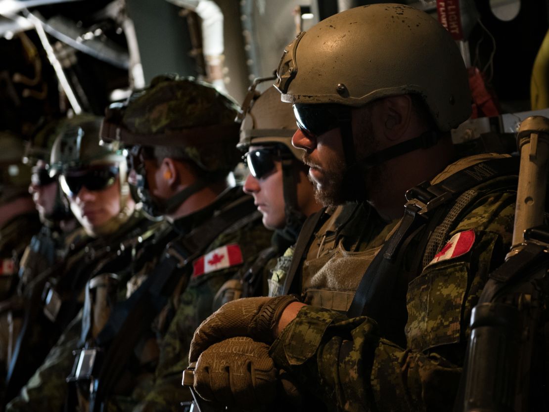 Members of the Canadian 2nd Battalion Royal 22e Régiment wait to take off during loading and offloading drills for the MV-22 Osprey during Rim of the Pacific exercises on Thursday.