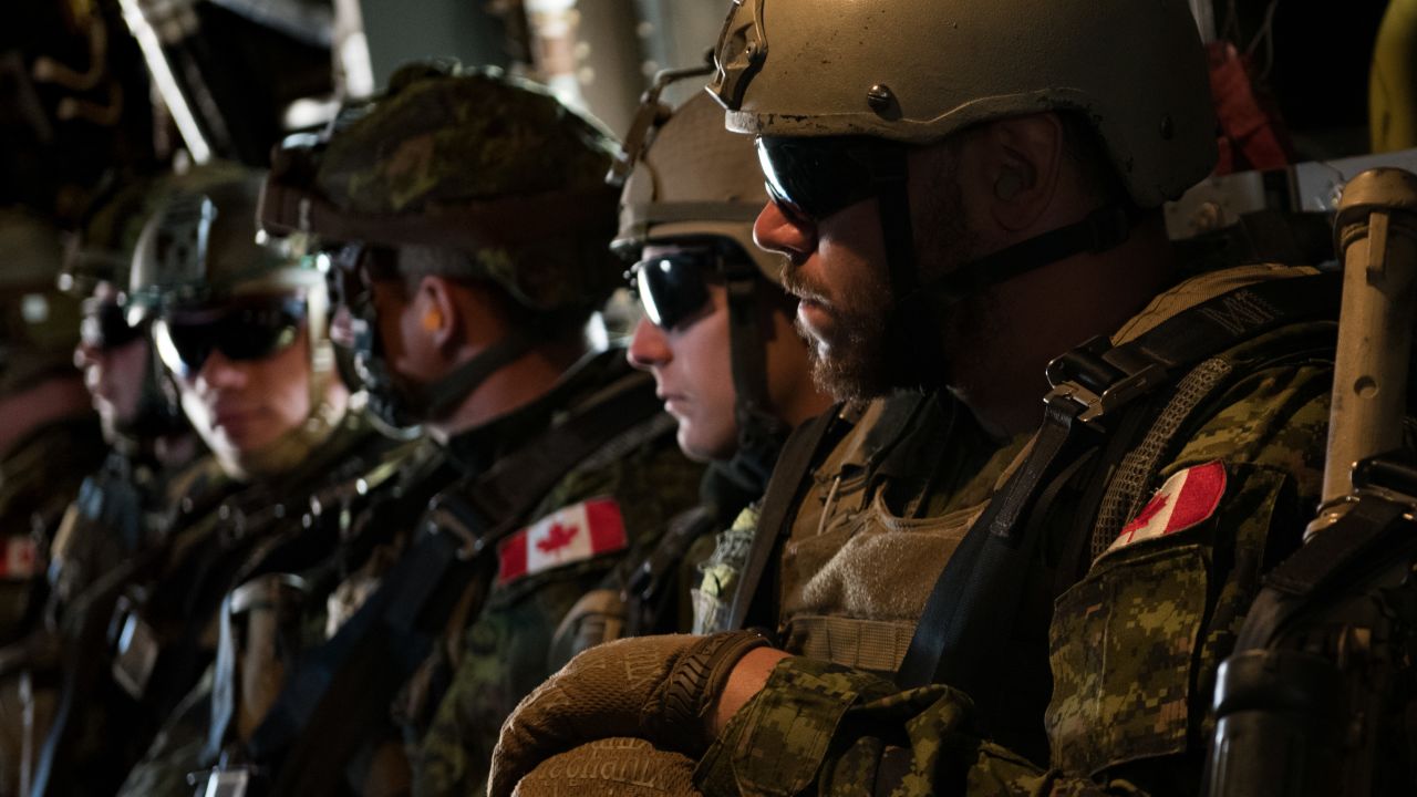 Members of the Canadian 2nd Battalion Royal 22e Régiment wait to take off during loading and offloading drills for the MV-22 Osprey during Rim of the Pacific exercises on Thursday.