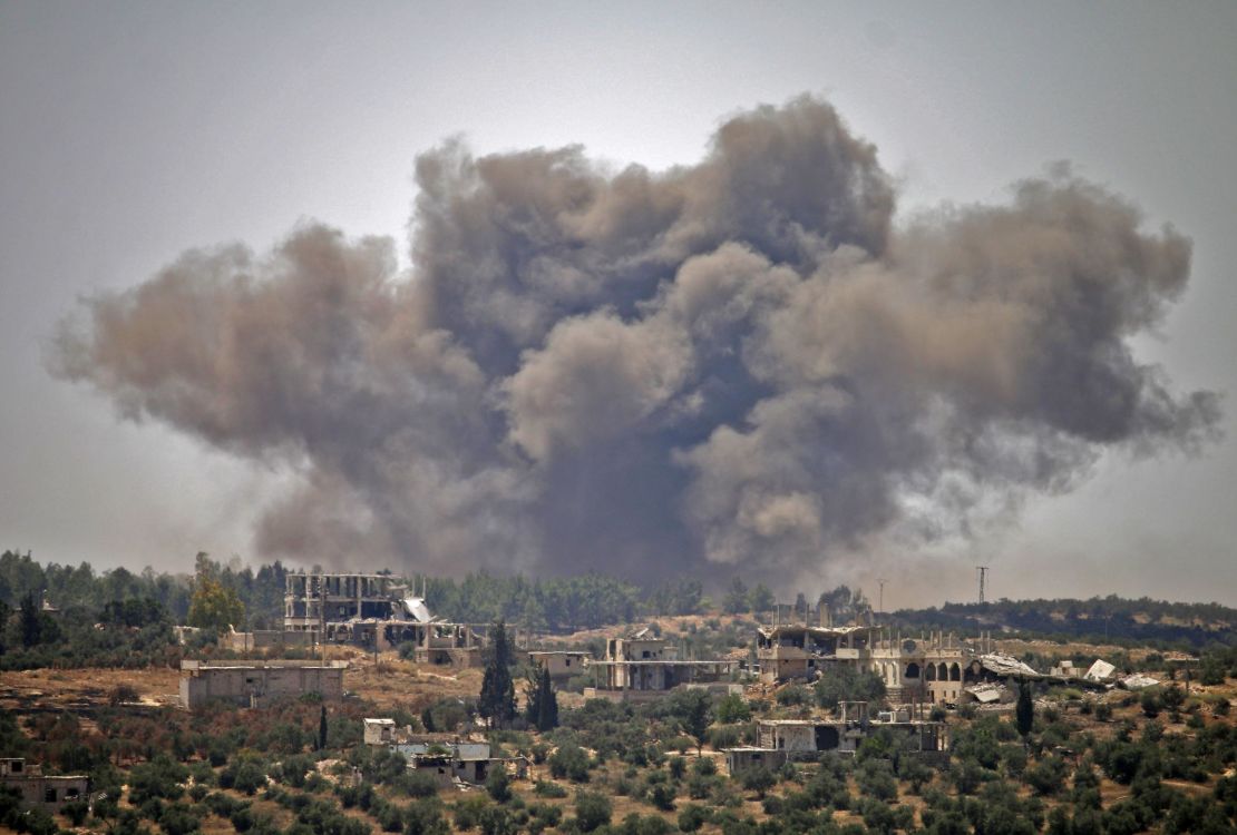 Smoke rises above opposition held areas of the city of Dara'a during airstrikes by Syrian regime forces on June 28, 2018. 