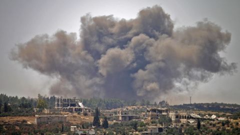 Smoke rises above opposition held areas of the city of Dara'a during airstrikes by Syrian regime forces on June 28, 2018. 