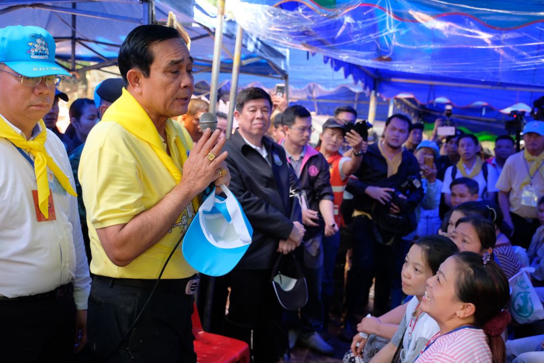 Thai Prime Minister Prayut Chan-O-Cha speaks to the family members of the missing children and their coach on Friday.