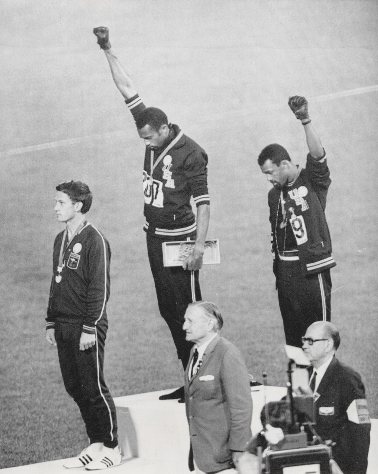 Two-hundred-meter gold medalist Tommie Smith and bronze medalist John Carlos raise their fists in protest at the 1968 Olympics in Mexico City.