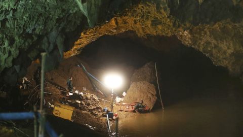 Thai soldiers walk out of the entrance to the Tham Luang Nang Non cave on Friday.