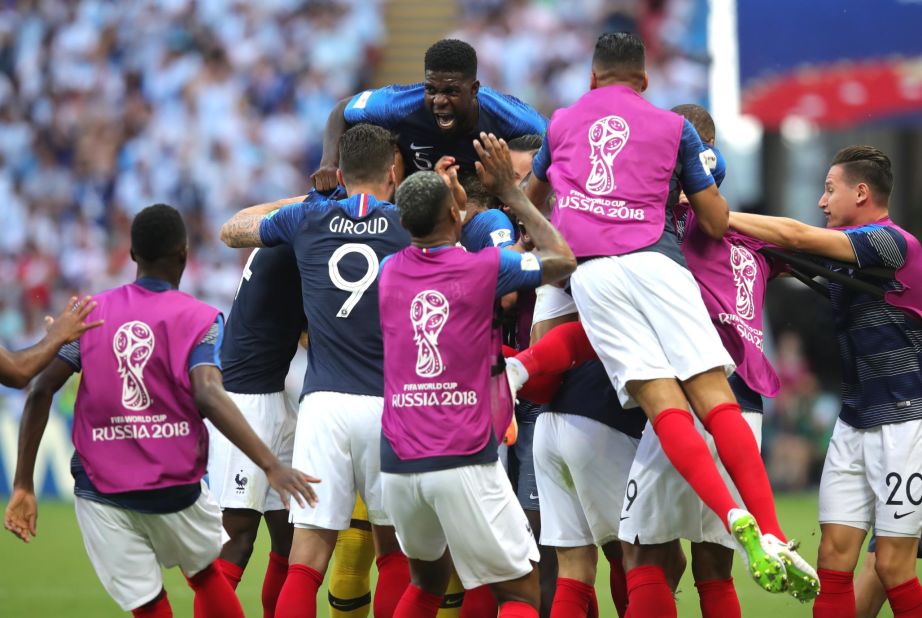 French players celebrate after Benjamin Pavard tied the match at 2-2.