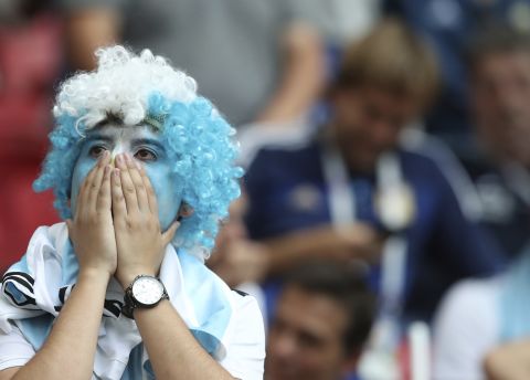 An Argentina fan reacts after the match.