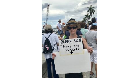 Michelle Gunderson holds her sign at the West Palm Beach, Florida, demonstration.