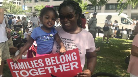 Akossiwa Lawrence and her 2-year-old daughter attend the demonstration in Washington.
