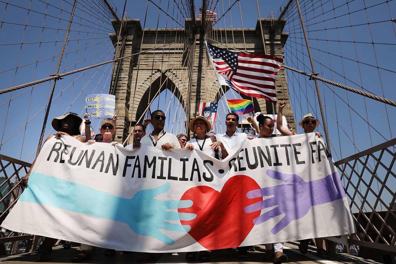 New York: People march across the Brooklyn Bridge in support of families separated at the border.