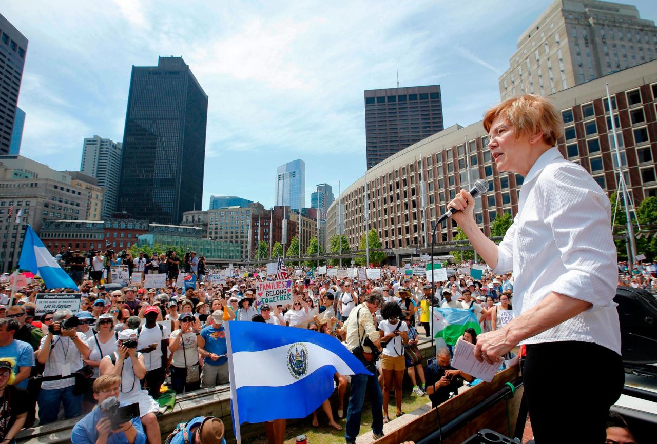 Boston: US Sen. Elizabeth Warren of Massachusetts speaks at the rally while a protester holds the flag of El Salvador in the foreground.