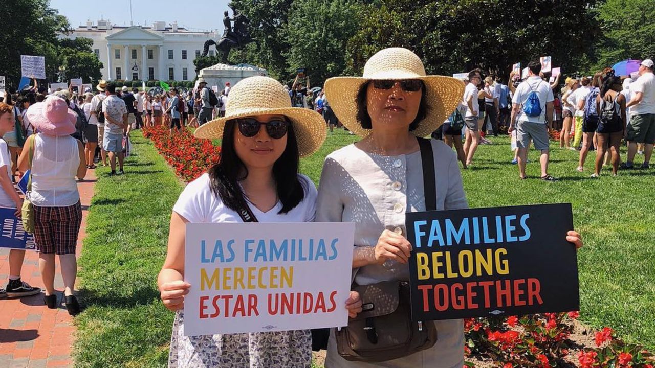 Erin Vong stands beside her mother, Felecia, at a protest in Washington.