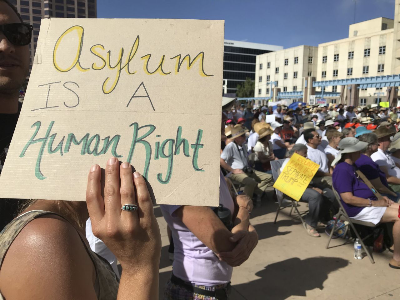Albuquerque, New Mexico: A protester holds a sign as demonstrators gather downtown at Civic Plaza calling for an end to family separation.