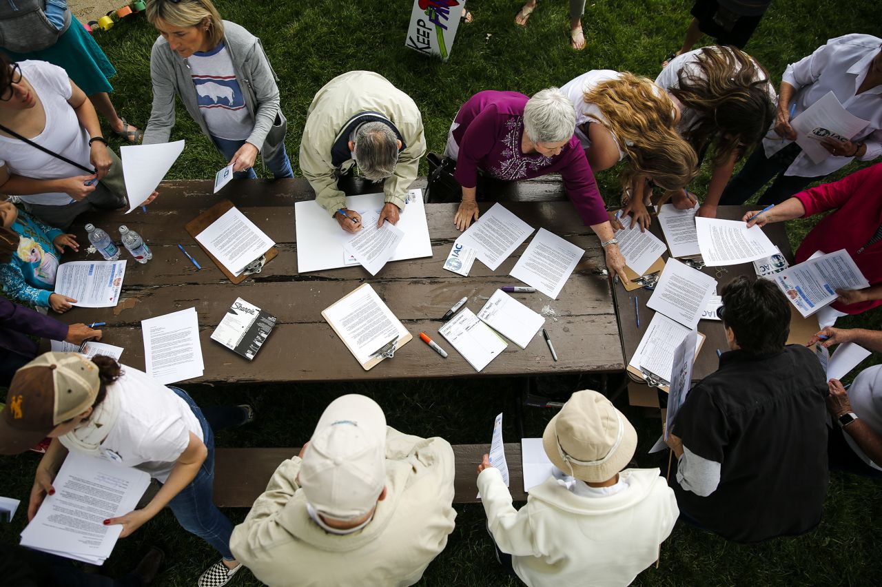 Casper, Wyoming: People write letters to members of the Wyoming congressional delegation following an immigration rally in Pioneer Park.