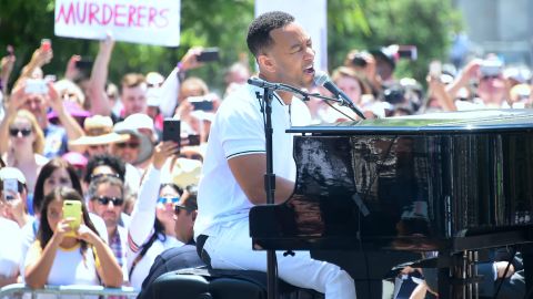 John Legend performs  for thousands  at the rally in Los Angeles. 