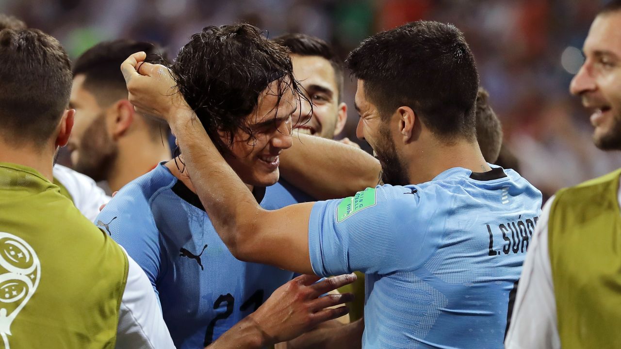 Cavani and Suarez celebrate Uruguay's winner.