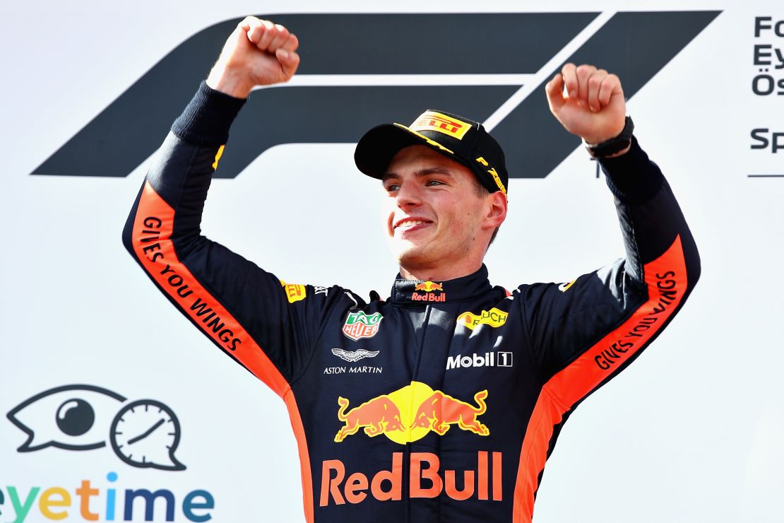 Race winner Max Verstappen celebrates on the podium after taking victory in Austria for Red Bull.