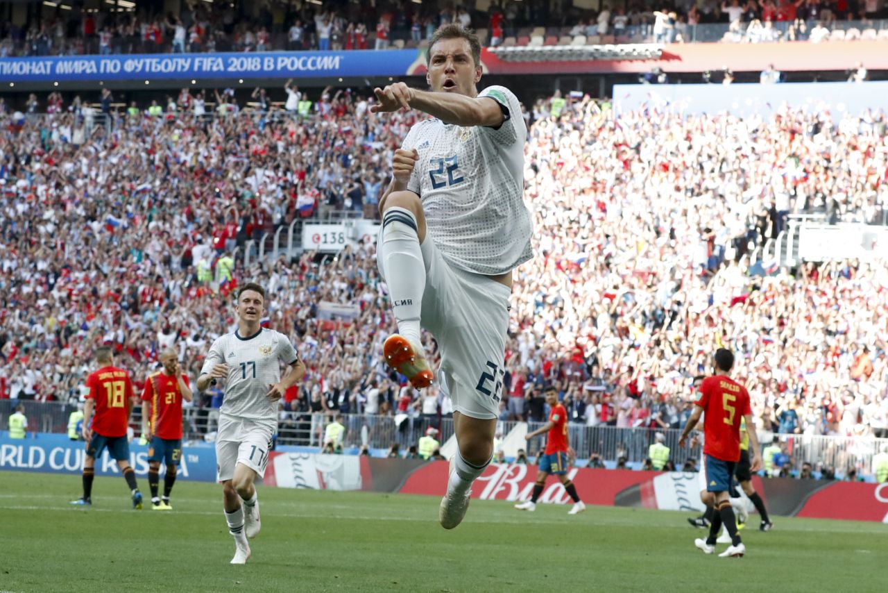 Russia's Artem Dzyuba celebrates after scoring against Spain in the first half.