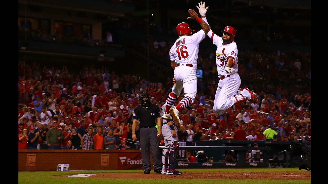 Kolten Wong, left, and Jose Martinez of the St. Louis Cardinals celebrate after Martinez's three-run home run against the Cleveland Indians in the second inning on Tuesday, June 26.