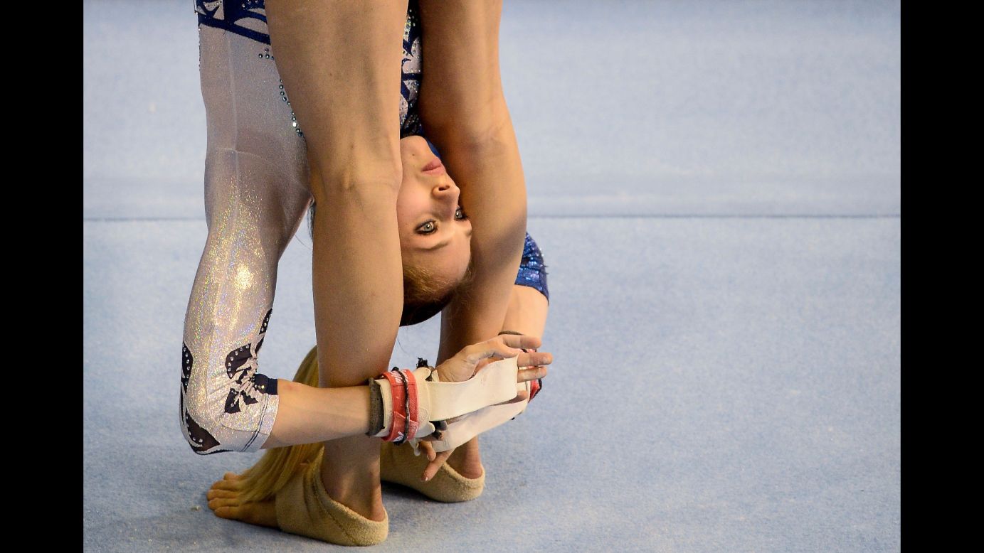 Giada Grisetti of Italy stretches during the Artistic Gymnastics finals at the Tarragona XVIII Mediterranean Games on Tuesday, June 26. Grisetti finished with a 4th place ranking in the uneven bars event.