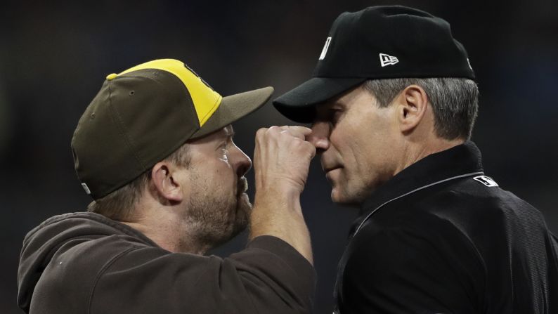 San Diego Padres manager Andy Green, left, argues with home plate umpire ángel Hernández before being ejected from the game against the Pittsburgh Pirates on Friday, June 29.