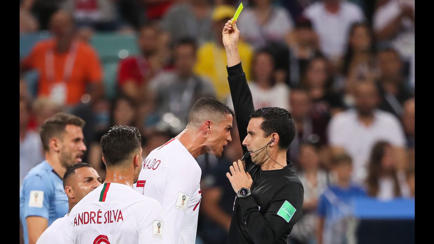 Cristiano Ronaldo of Portugal confronts referee César Ramos during the match between Uruguay and Portugal on Saturday, June 30. Uruguay knocked Portugal out of the World Cup with a 2-1 win.
