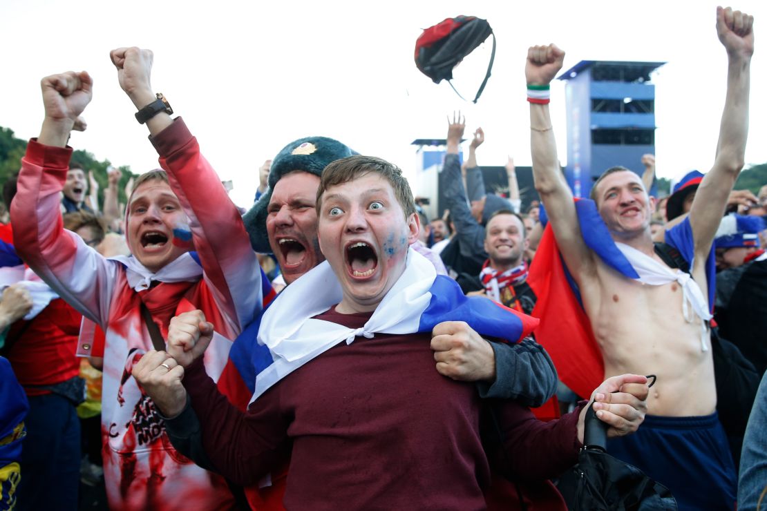 Russia fans celebrate after their national side beat Spain on penalties at the 2018 World Cup.