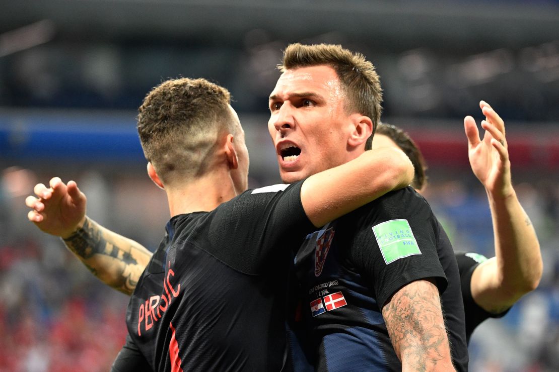 Mario Mandzukic (R) celebrates after scoring against Denmark.